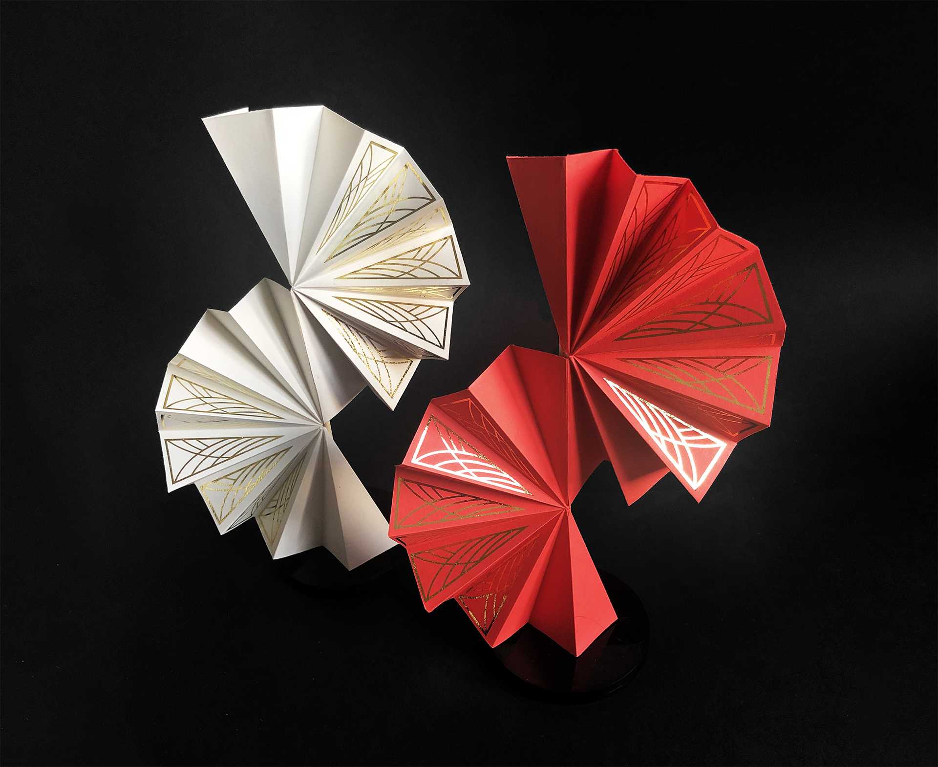 A paper object installation which explores the relationship between nature and the man-made through pattern, form and foiling. It also has end of life uses as decoration, a fan or a stationary clasp.