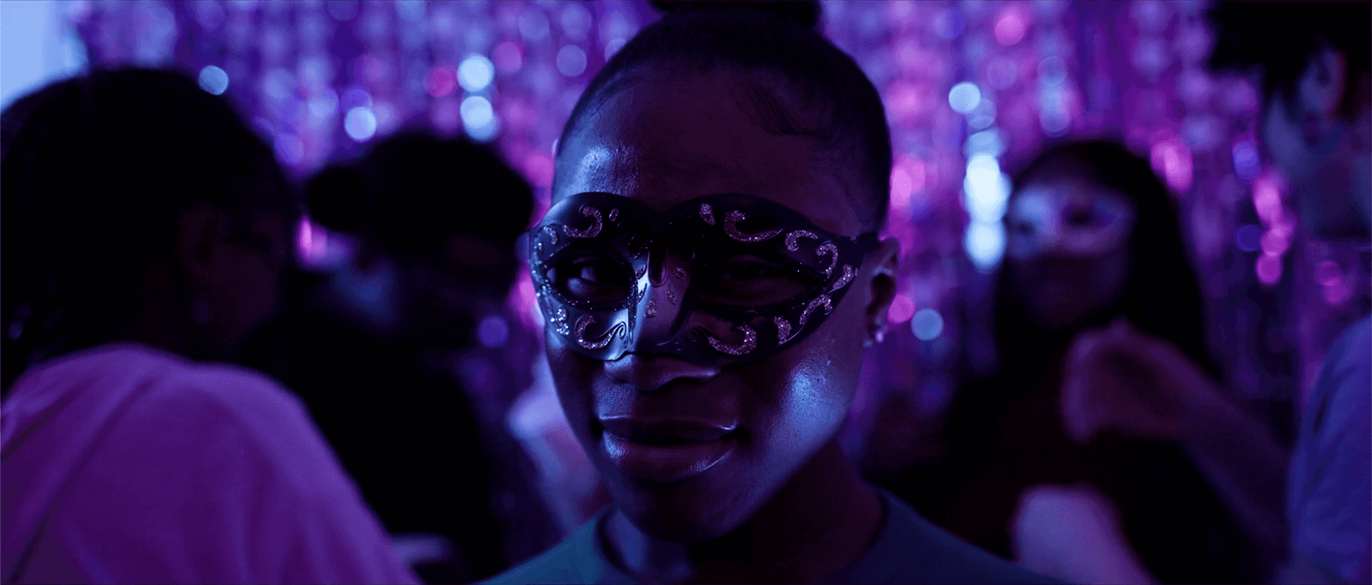 Woman in club wearing eye mask